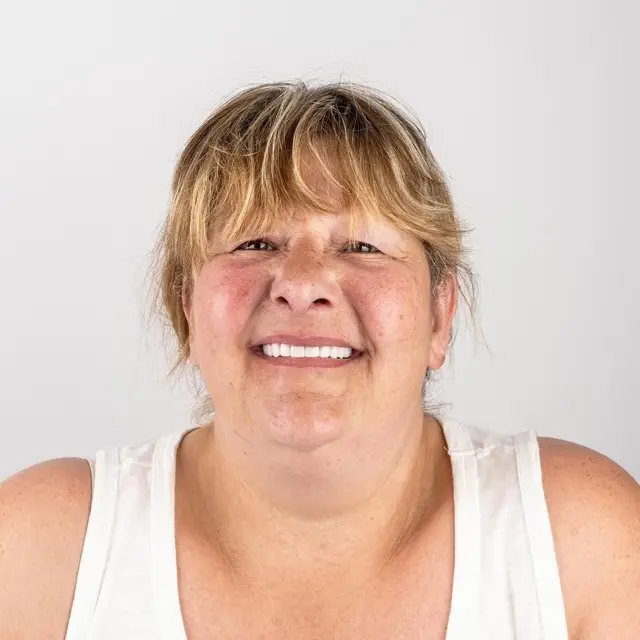 Precious Dental patient smiling after treatment