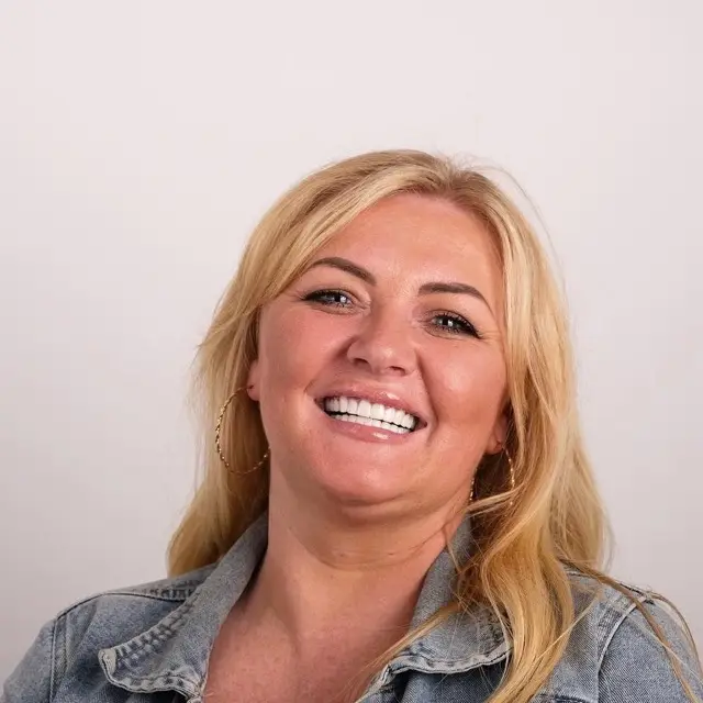 Precious Dental patient smiling after treatment